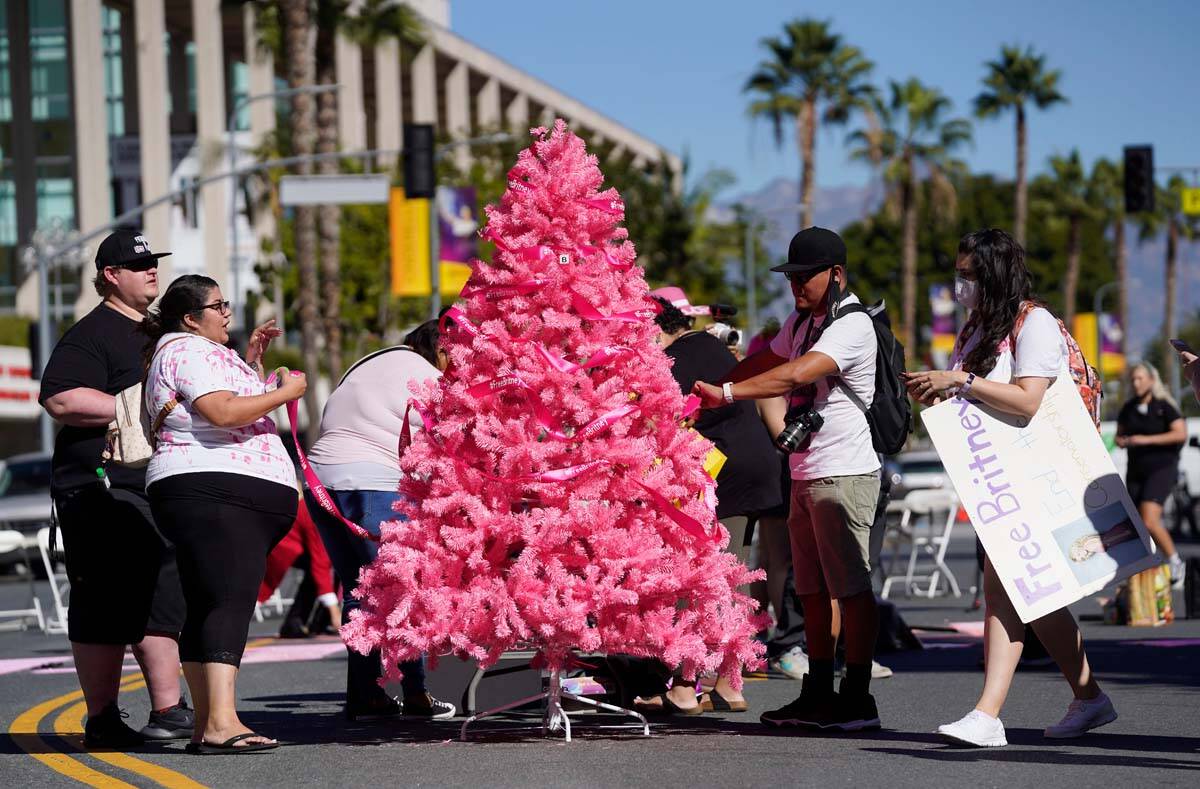 Britney Spears supporters decorate a pink "Free Britney" Christmas tree outside a hea ...