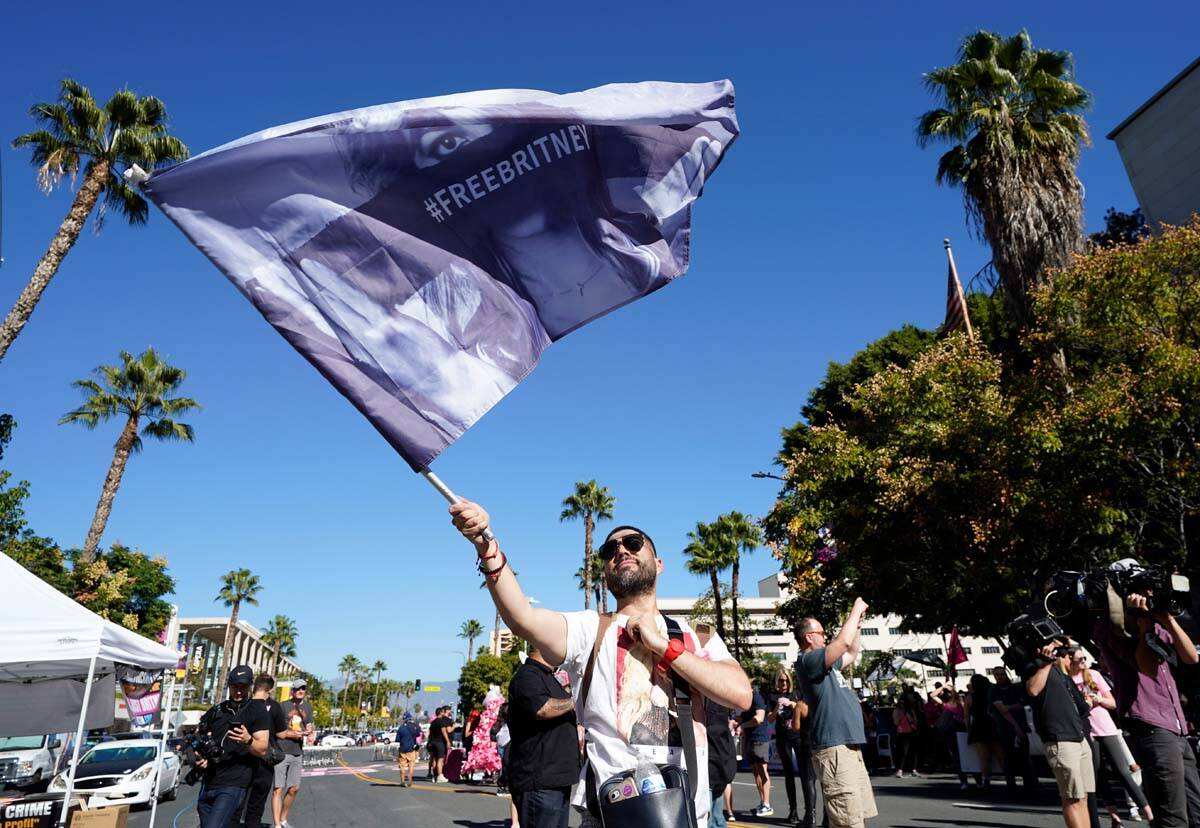 Britney Spears supporter Rafael Lopez, of Tijuana, Mexico, waves a "Free Britney" fla ...