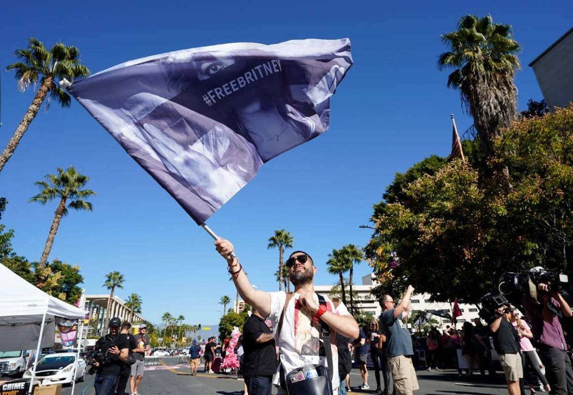 Britney Spears supporter Rafael Lopez, of Tijuana, Mexico, waves a "Free Britney" fla ...