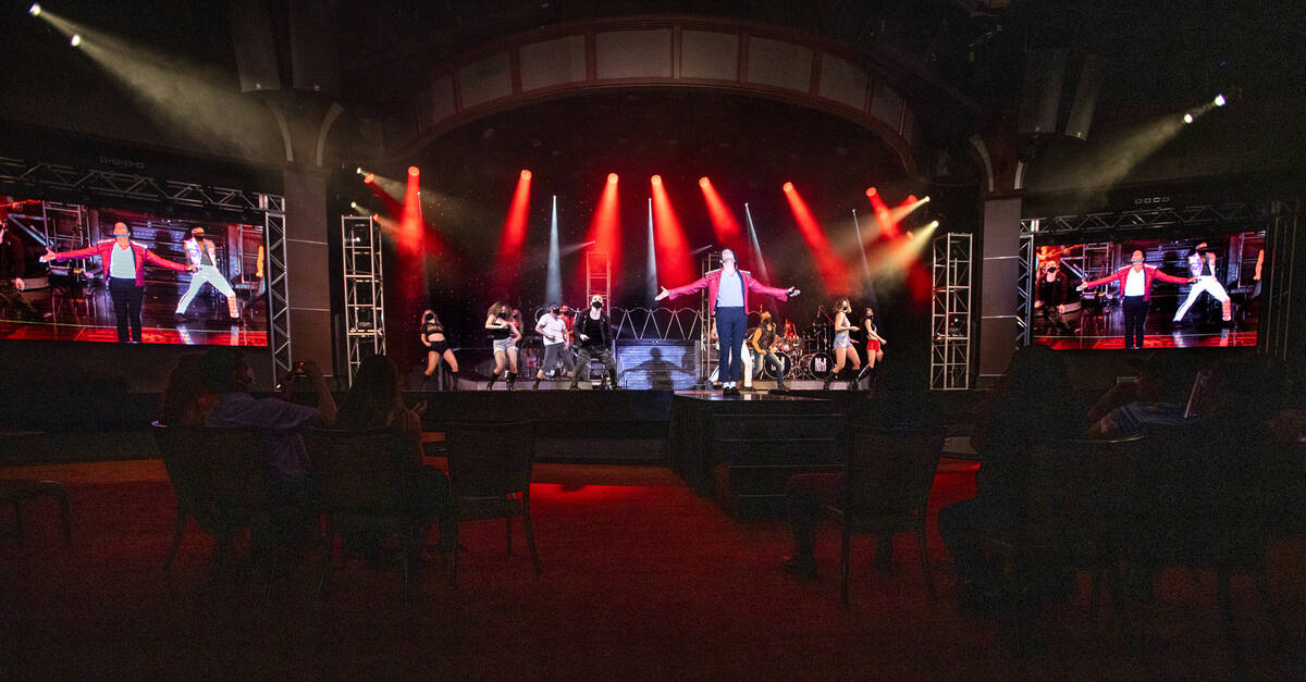 Jalles Franca as Michael Jackson performs along with dancers during the opening performance of ...