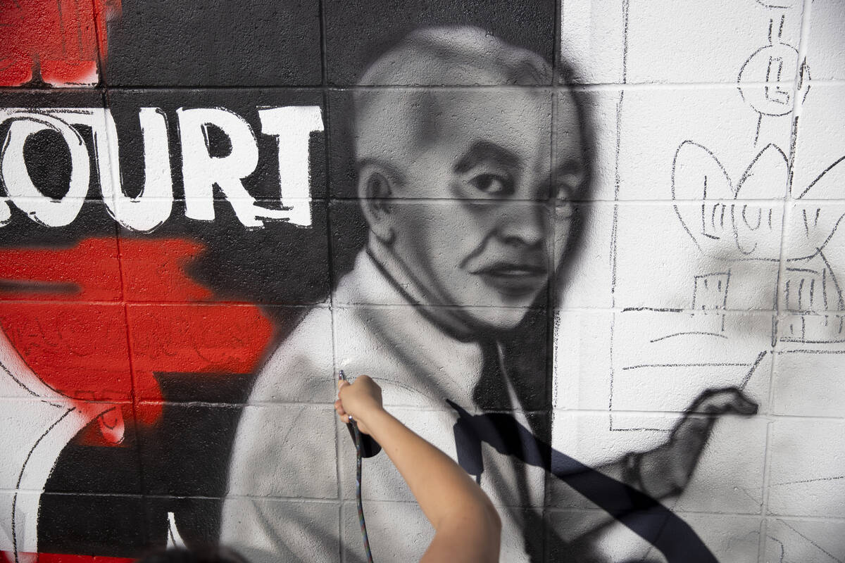 Nanda Sharifpour works on a mural outside of the Neon Museum North Gallery in Las Vegas, Tuesda ...
