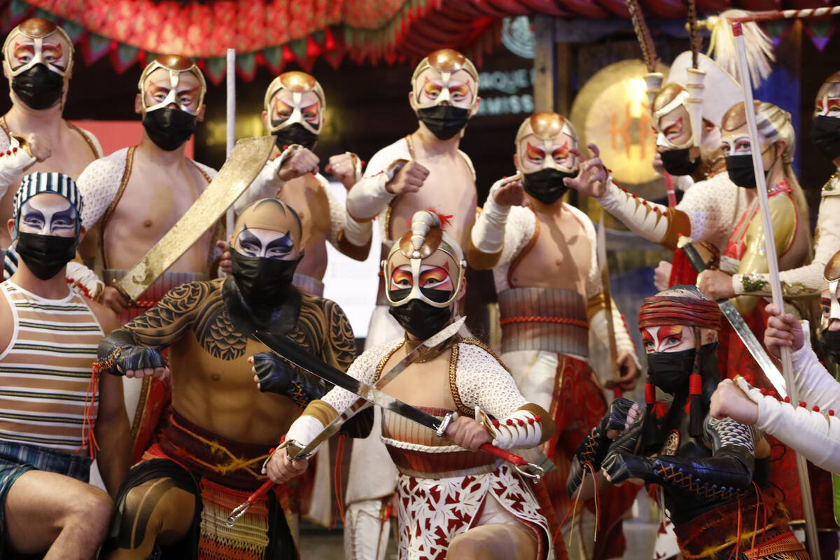 Cirque Du Soleil's KÀ artists pose for a photo in front of the theater before the production's ...
