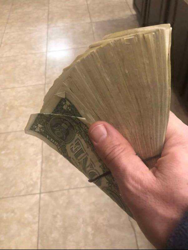 Vegas musician Steve Flora shows Dennis Rodman's $300 tip, all in $100 bills, from Rodman's sto ...