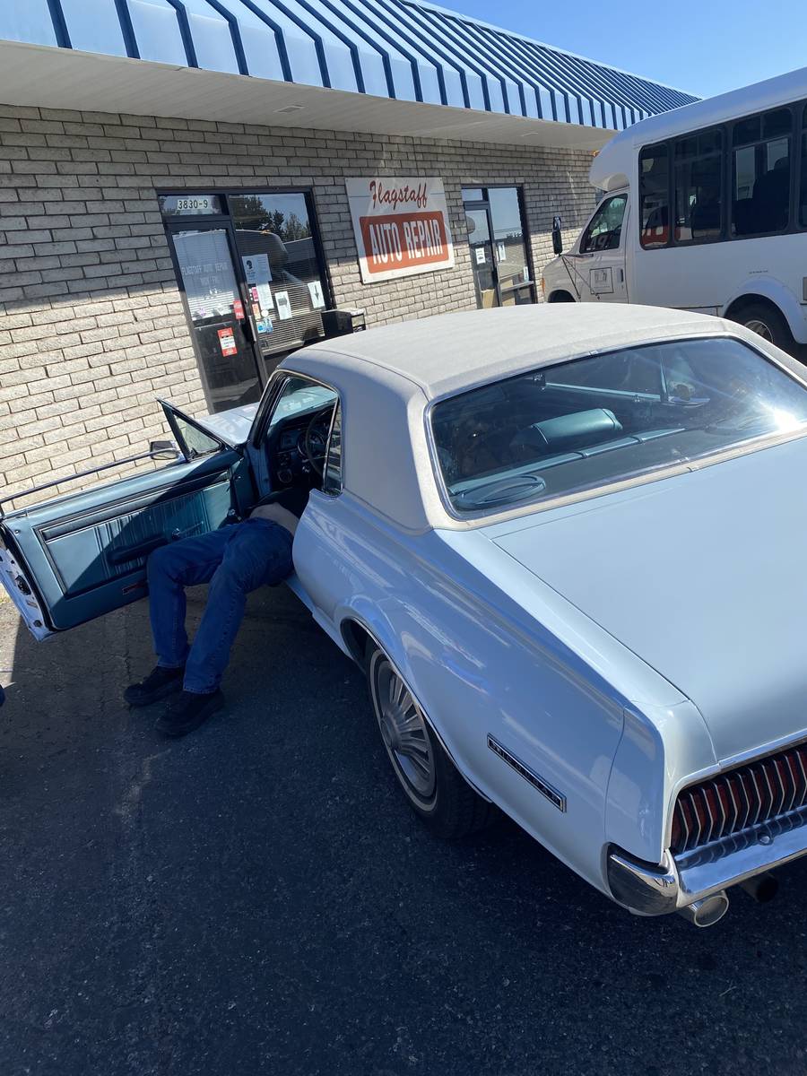 Flagstaff (Ariz.) Auto Repair owner Howard DeVore is shown checking a brake-light switch in R-J ...