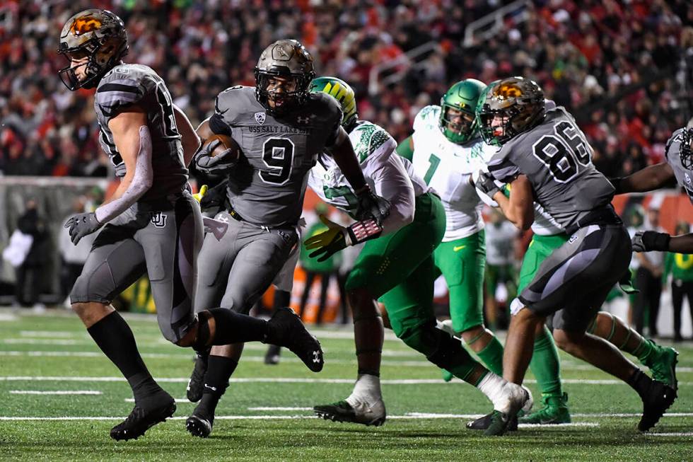 Utah running back Tavion Thomas (9) runs into the end zone during the second half of an NCAA co ...