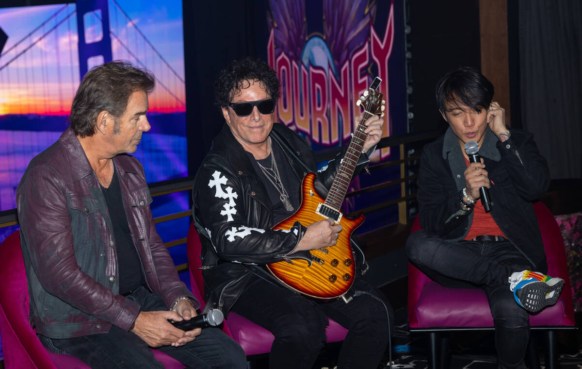 Members of the superstar rock band Journey, from left, Jonathan Cain, Neal Schon and Arnel Pine ...