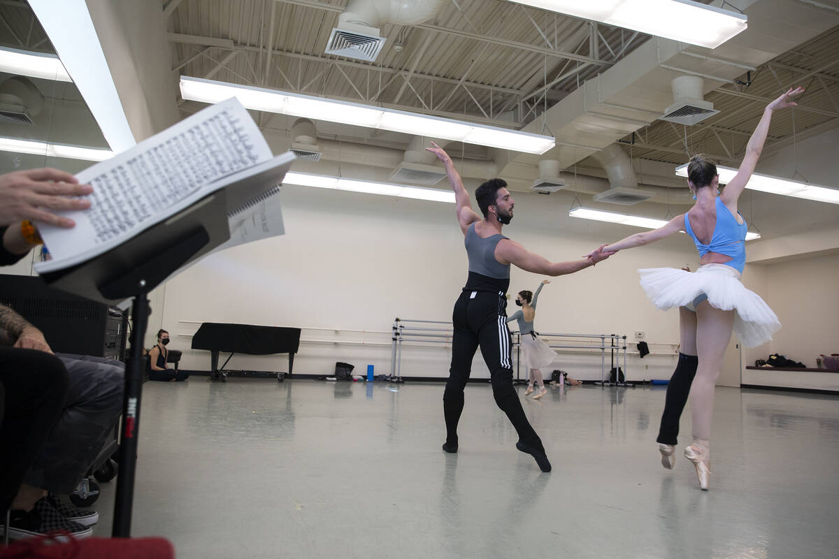 Daniel Barba, center, and Mirella Costa Neto rehearse for the upcoming presentation of "The Nut ...
