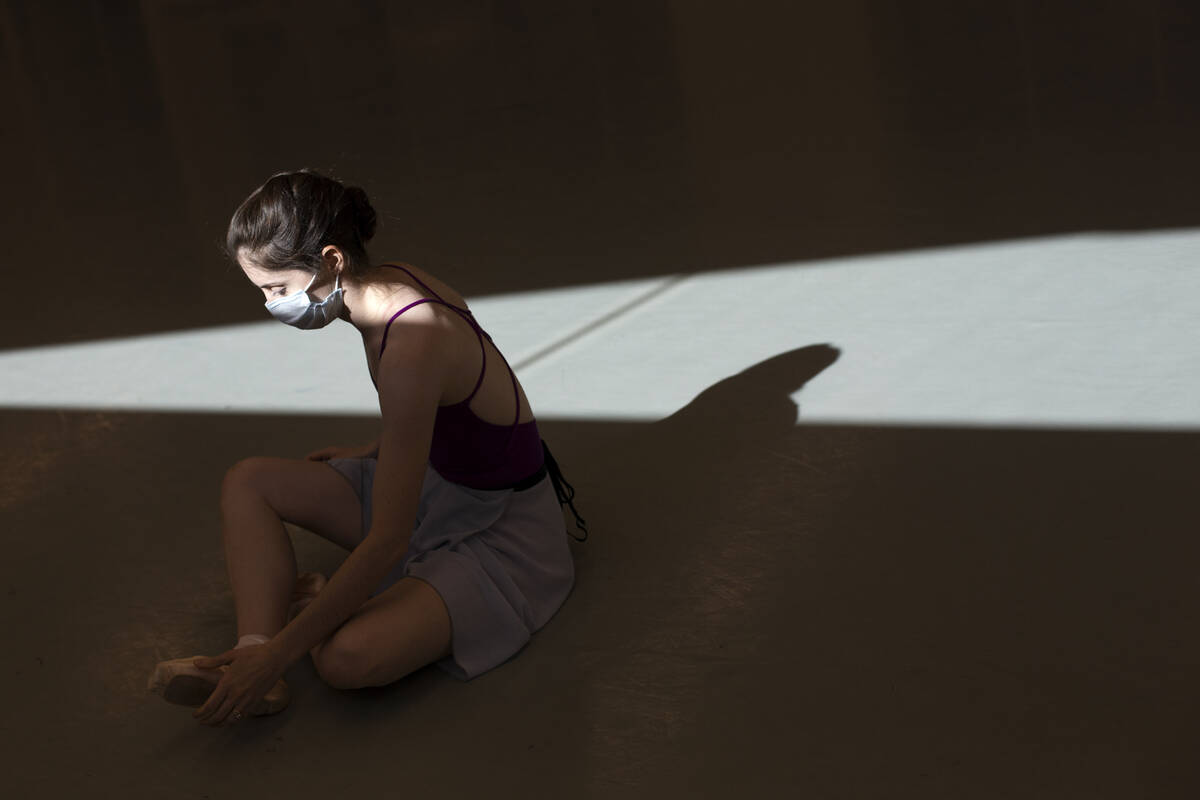 Emma McGirr stretches during a rehearsal for the upcoming presentation of "The Nutcracker" at N ...