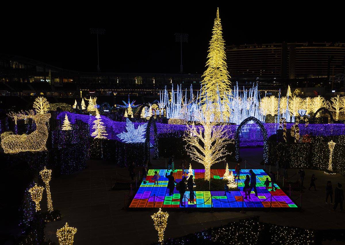 Attendees explore Enchant Christmas at Las Vegas Ballpark on Tuesday, Nov. 30, 2021, in Las Veg ...