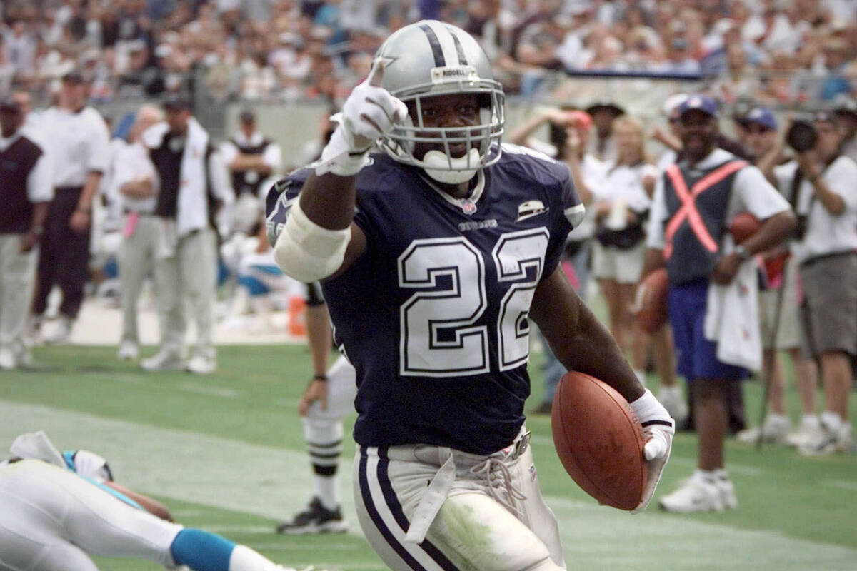 Dallas Cowboys' Emmitt Smith celebrates his touchdown run in the second quarter against the Car ...