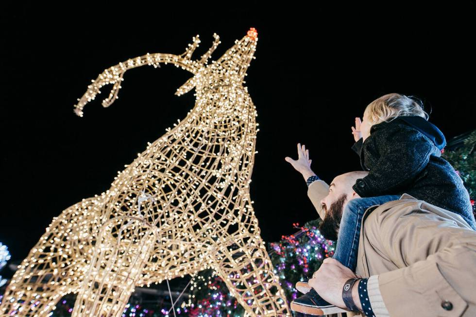 The new attraction Enchant Christmas features a Christmas village, light maze and ice skating t ...