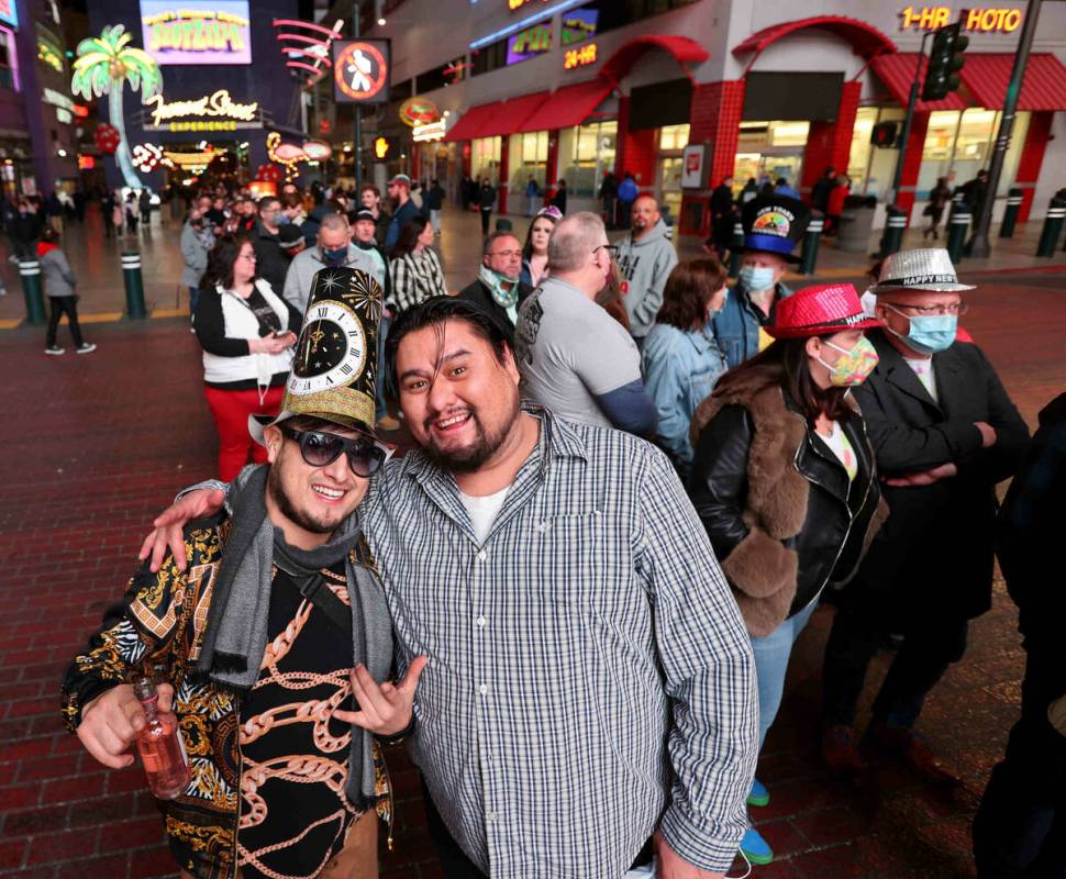 Brothers Miguel Carmona, left, and Arte Carmona of Los Angeles wait in line to get into the New ...