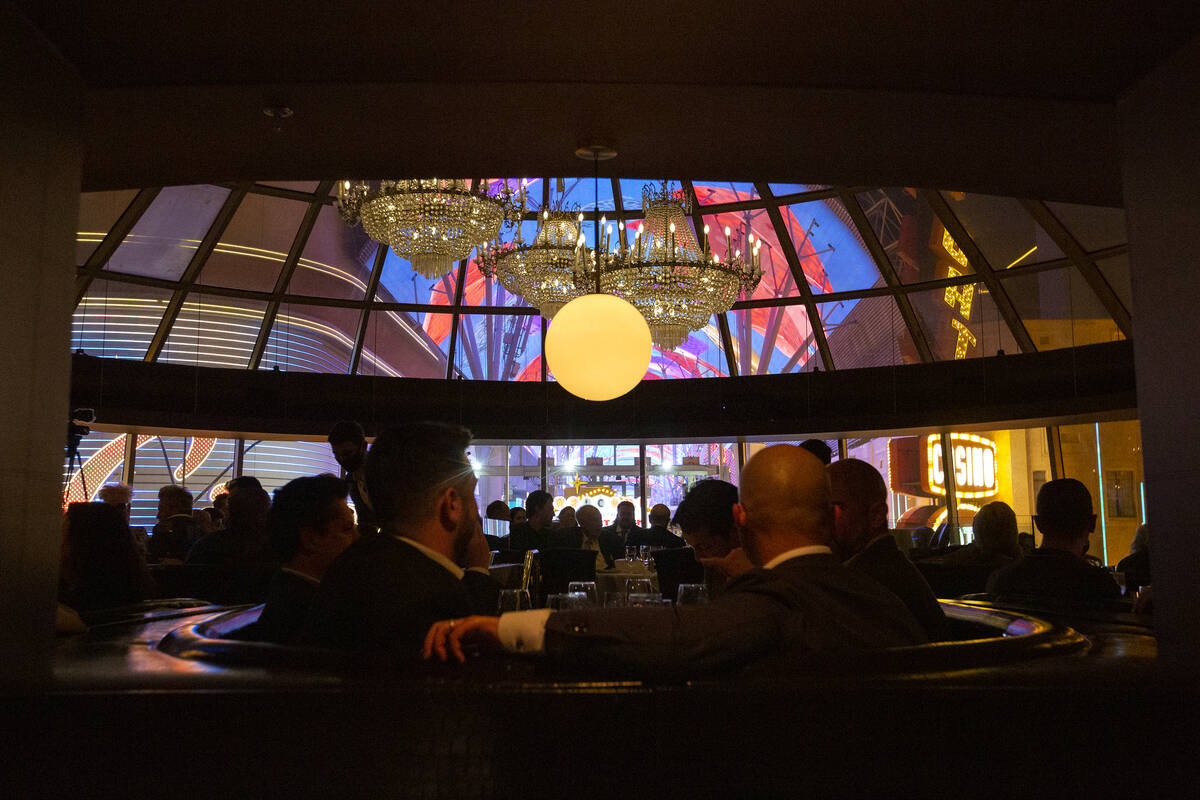 Attendees of the 10th anniversary party for Oscar’s Steakhouse listen to a roast of form ...