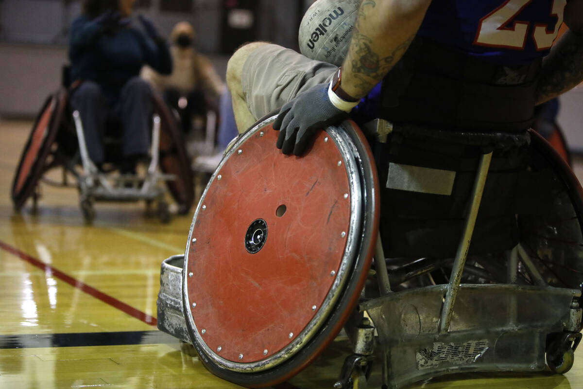 Peter Vinnitsky, High Rollers coach, plays wheelchair rugby at Dula Gym during a demonstration ...