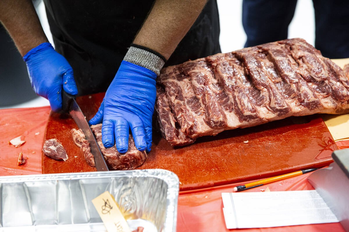 Butchers compete in the second round of the National Meat Cutter Challenge at Lifeguard Arena o ...