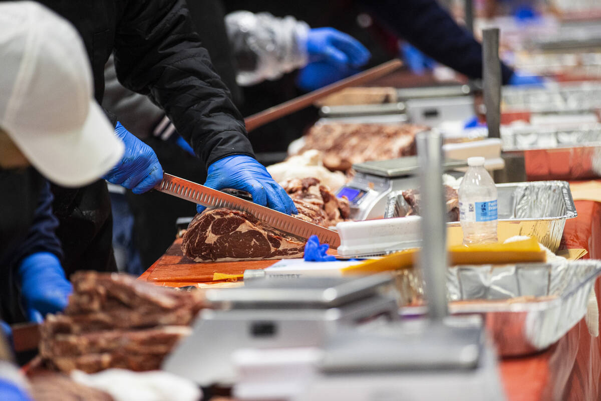 Butchers compete in the second round of the National Meat Cutter Challenge at Lifeguard Arena o ...