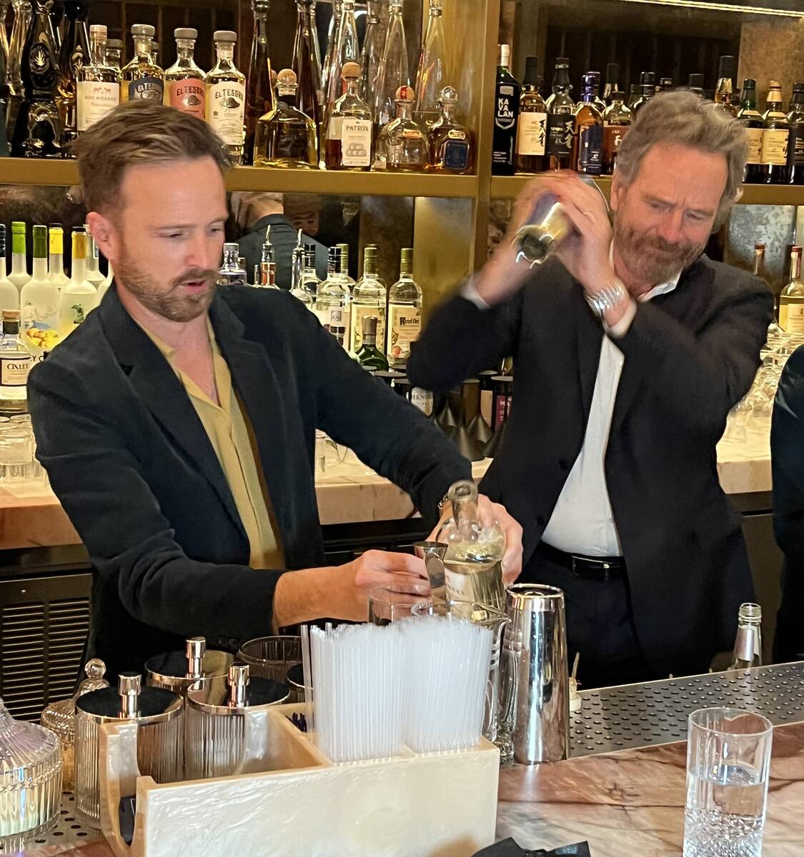 "Breaking Bad" co-stars Aaron Paul and Bryan Cranston mix drinks with their Dos Hombres mezcal ...