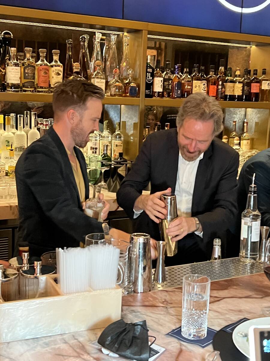 "Breaking Bad" co-stars Aaron Paul and Bryan Cranston mix drinks with their Dos Hombres mezcal ...