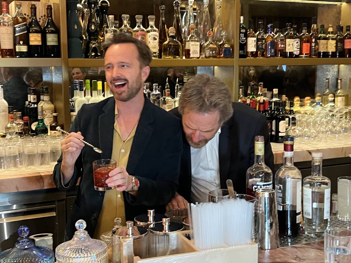 "Breaking Bad" co-stars Aaron Paul and Bryan Cranston mix drinks with their Dos Hombres mezcal ...