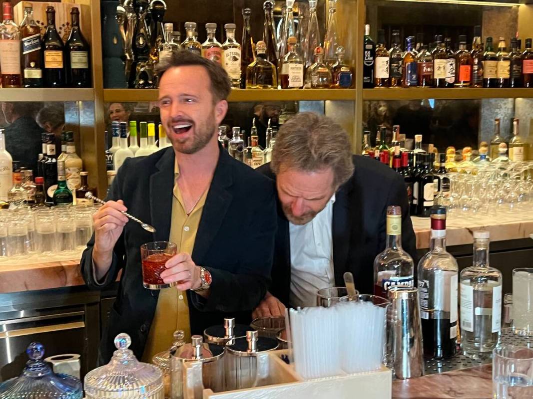 "Breaking Bad" co-stars Aaron Paul and Bryan Cranston mix drinks with their Dos Hombres mezcal ...