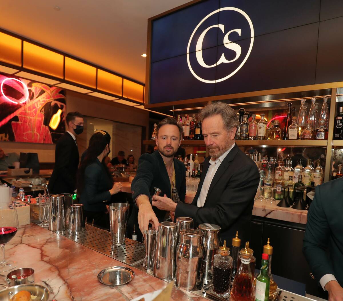 "Breaking Bad" co-stars Aaron Paul and Bryan Cranston mix drinks with their Dos Hombres mezcal ...
