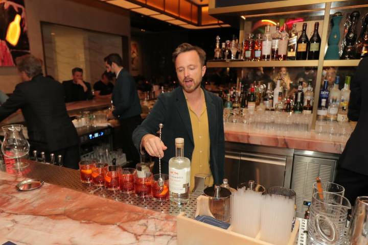 "Breaking Bad" co-star Aaron Paul mixes a drink with his Dos Hombres mezcal at Carversteak at R ...