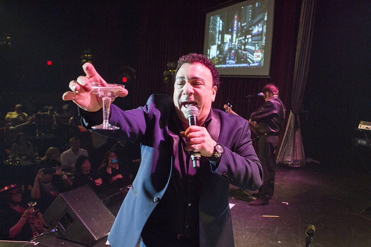 Frankie Scinta with the Scintas makes a New Year's toast on stage during their show at the Plaz ...