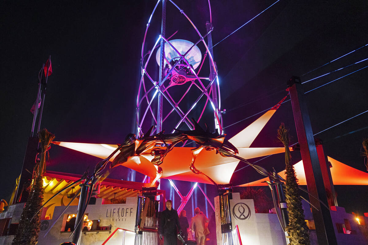 Michael Beneville, bottom/middle, chief creative officer with AREA15, introduces the new ride L ...
