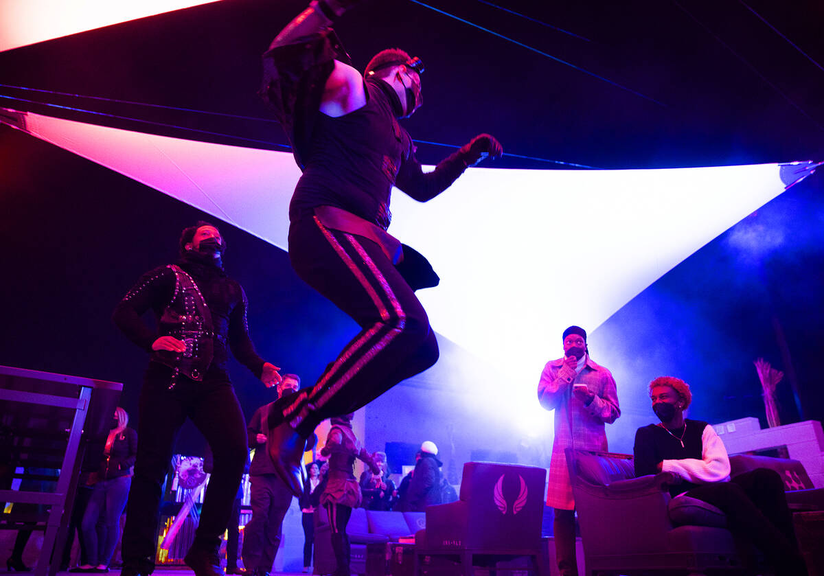 Dancers entertain the crowd during an event to introduce new ride Liftoff at AREA15 on Wednesd ...