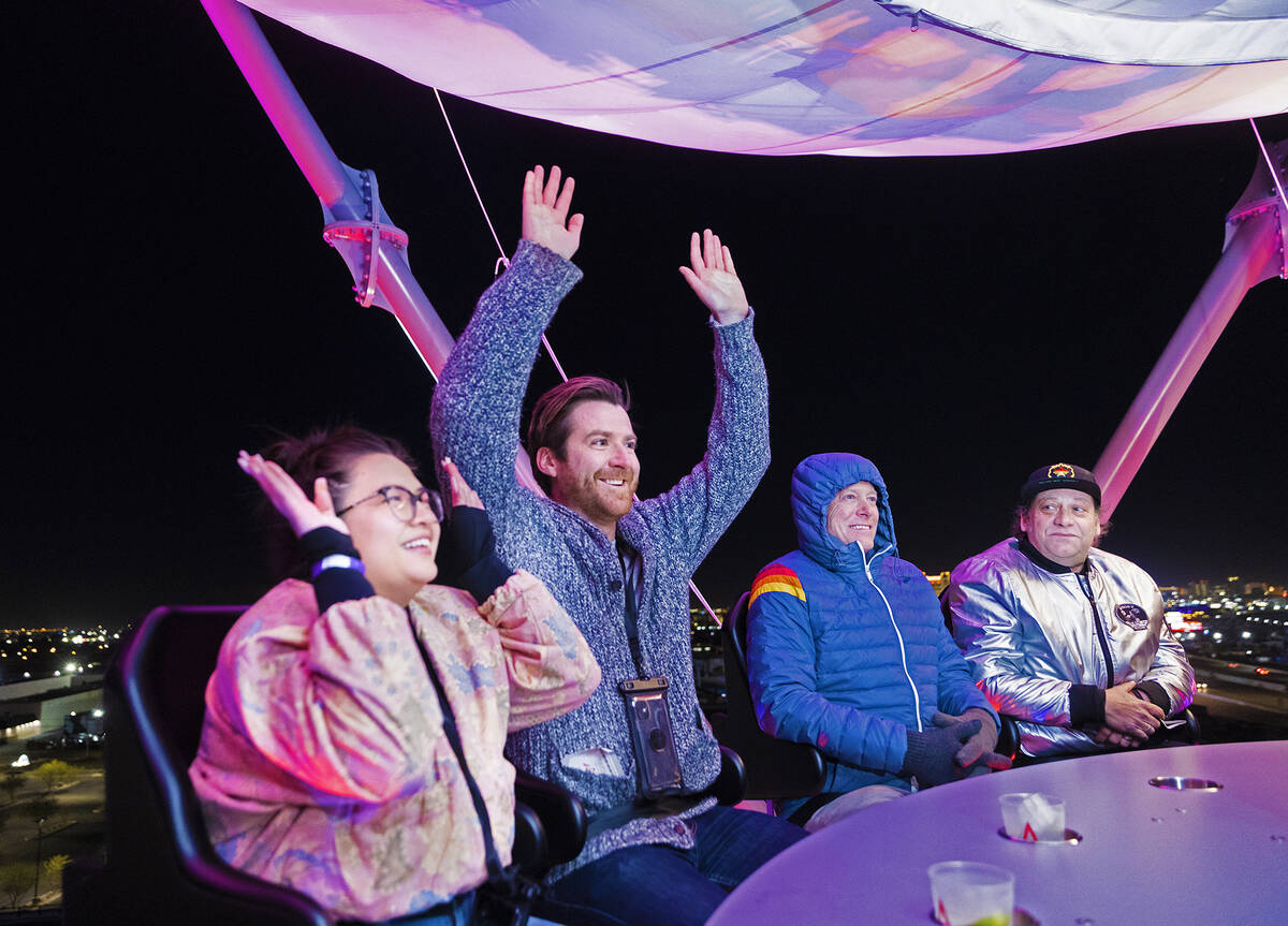 Nicole Reynolds, left, and Brett Forrest cheer during their ride on Liftoff at AREA15 on Wednes ...
