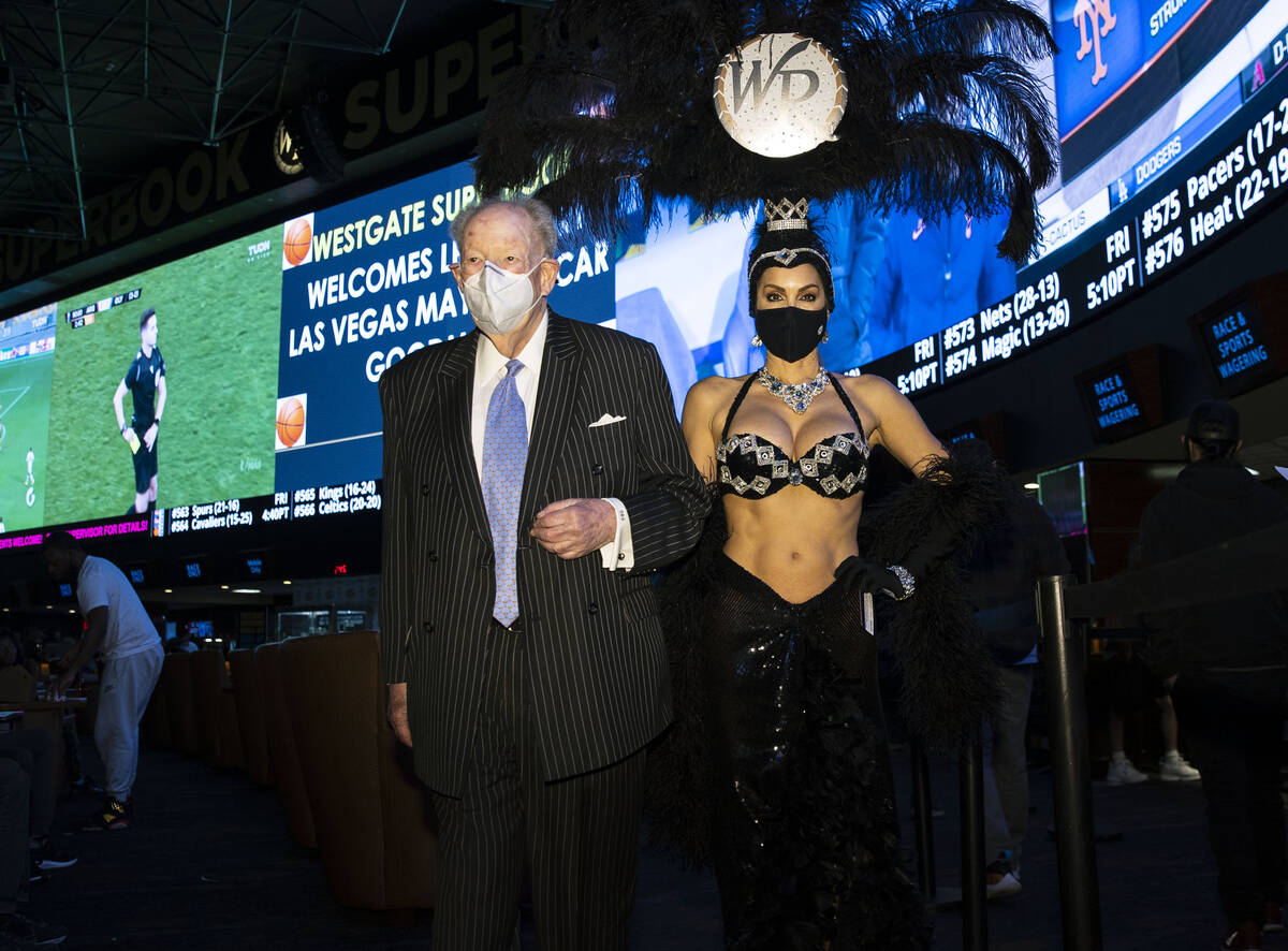 Former Las Vegas Mayor Oscar Goodman leaves Westgate Superbook with showgirl Jennifer Gagliano ...