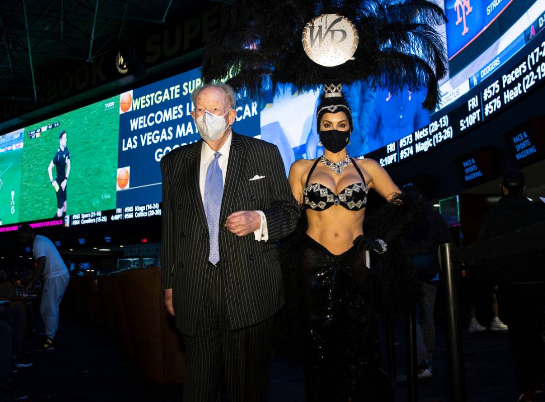 Former Las Vegas Mayor Oscar Goodman leaves Westgate Superbook with showgirl Jennifer Gagliano ...