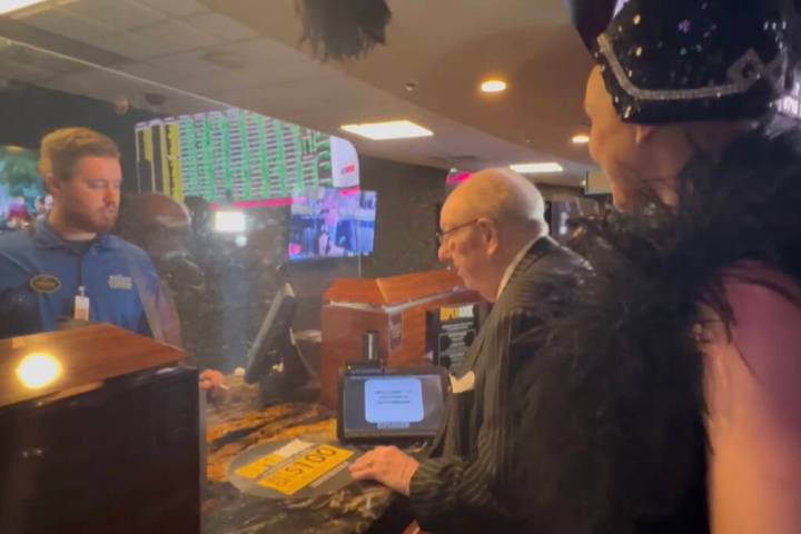 Oscar Goodman attempts to make his annual Super Bowl bet with Andrew Dupont, as Showgirl Kristi ...