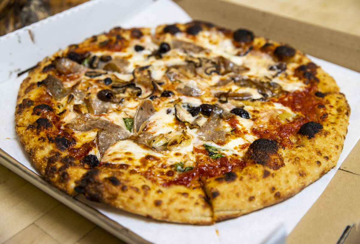 A finished pizza by restaurant owner and chef Giovanni Mauro at Old School Pizzeria in Las Vega ...