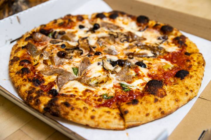 A finished pizza by restaurant owner and chef Giovanni Mauro at Old School Pizzeria in Las Vega ...