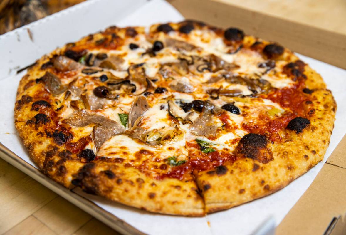 A finished pizza by restaurant owner and chef Giovanni Mauro at Old School Pizzeria in Las Vega ...