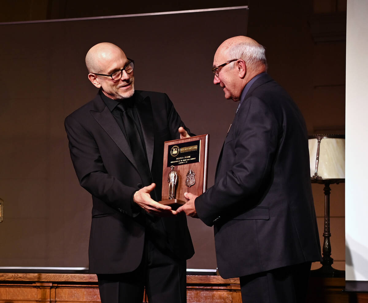 President & CEO of The Mob Museum Jonathan Ullman presents former FBI agent Joe Pistone with an ...