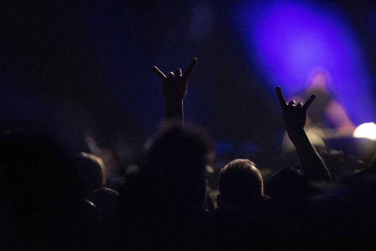 Fans watch Metallica perform in a music concert at Allegiant Stadium in Las Vegas, Friday, Feb. ...