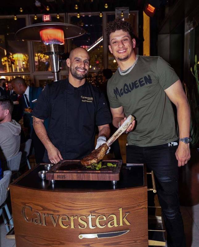 Kansas City Chiefs star quarterback, Patrick Mahomes, right, is presented with an American Wagy ...