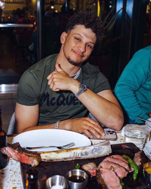 Kansas City Chiefs star quarterback, Patrick Mahomes, shows off the American Wagyu tomahawk rib ...