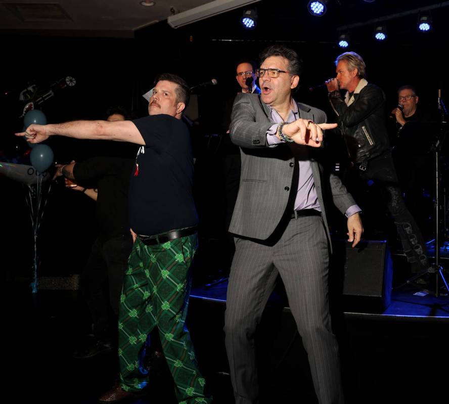 Las Vegas Review-Journal man-about-town columnist John Katsilometes, right, dances with Enoch A ...