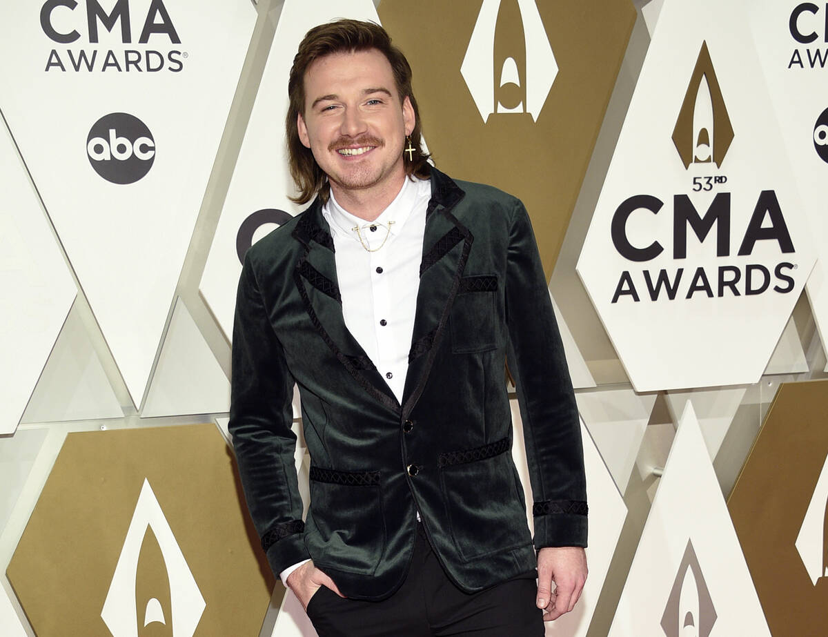 FILE - Morgan Wallen arrives at the 53rd annual CMA Awards on Nov. 13, 2019, in Nashville, Tenn ...