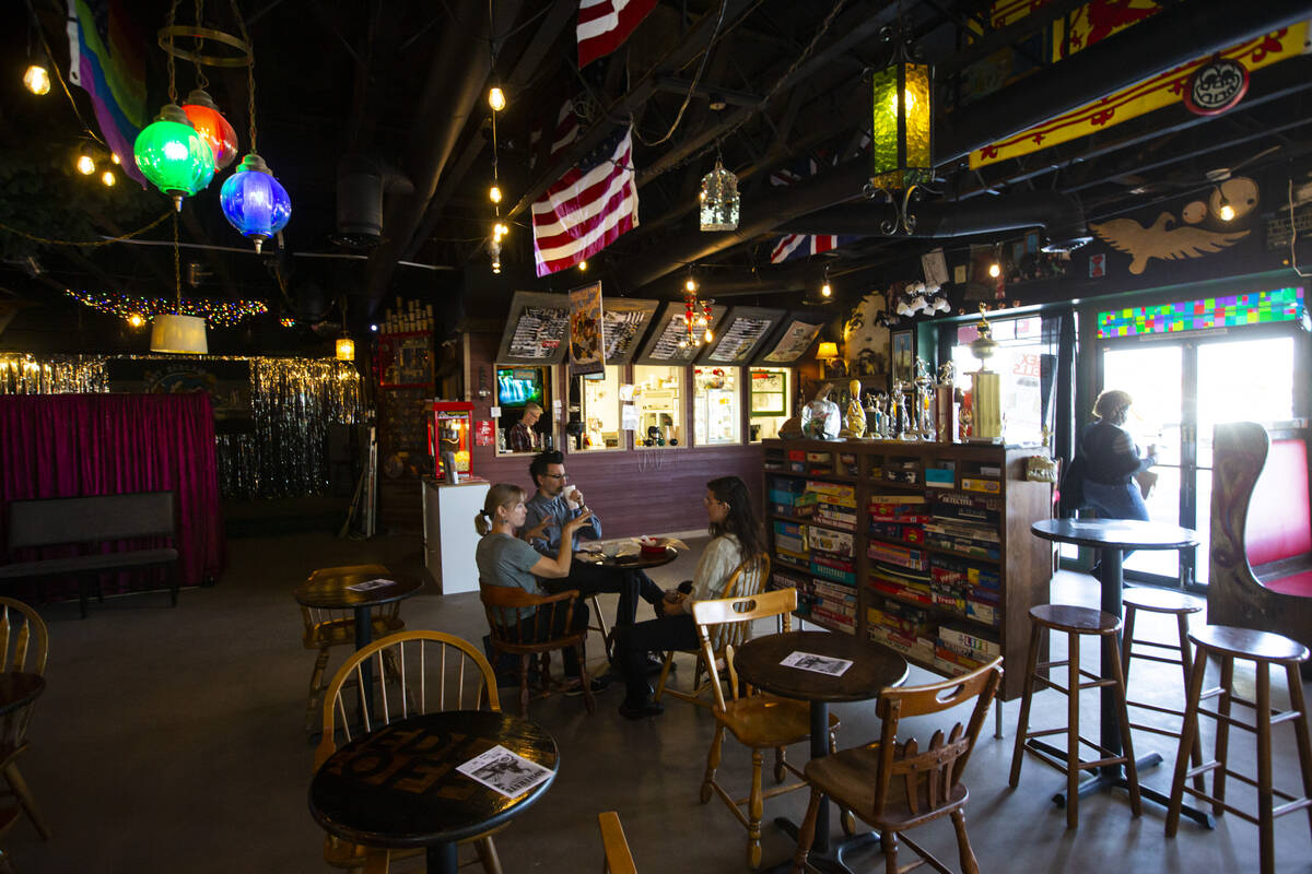 Unidentified hipsters talk about cool stuff at Fort Bedlam coffee house in New Orleans Square o ...