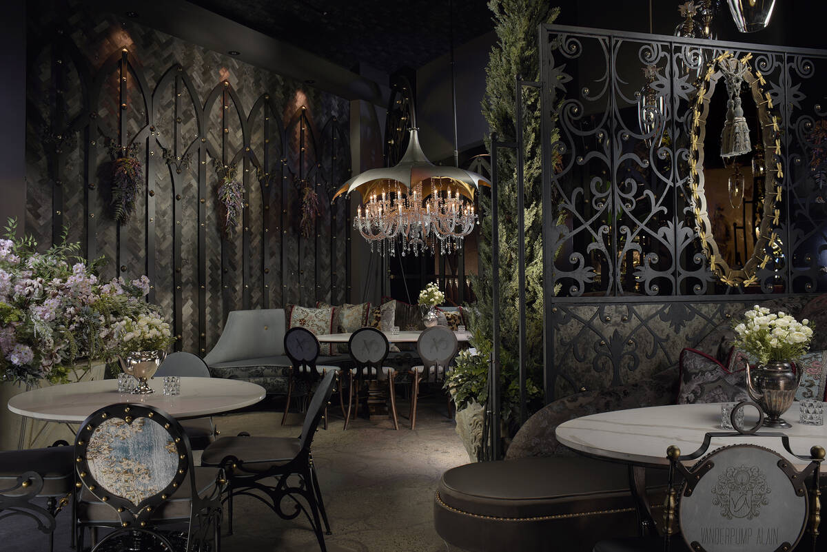 Crystal chandeliers and wrought iron cages are a key focal point of the decor. (Photo credit: E ...