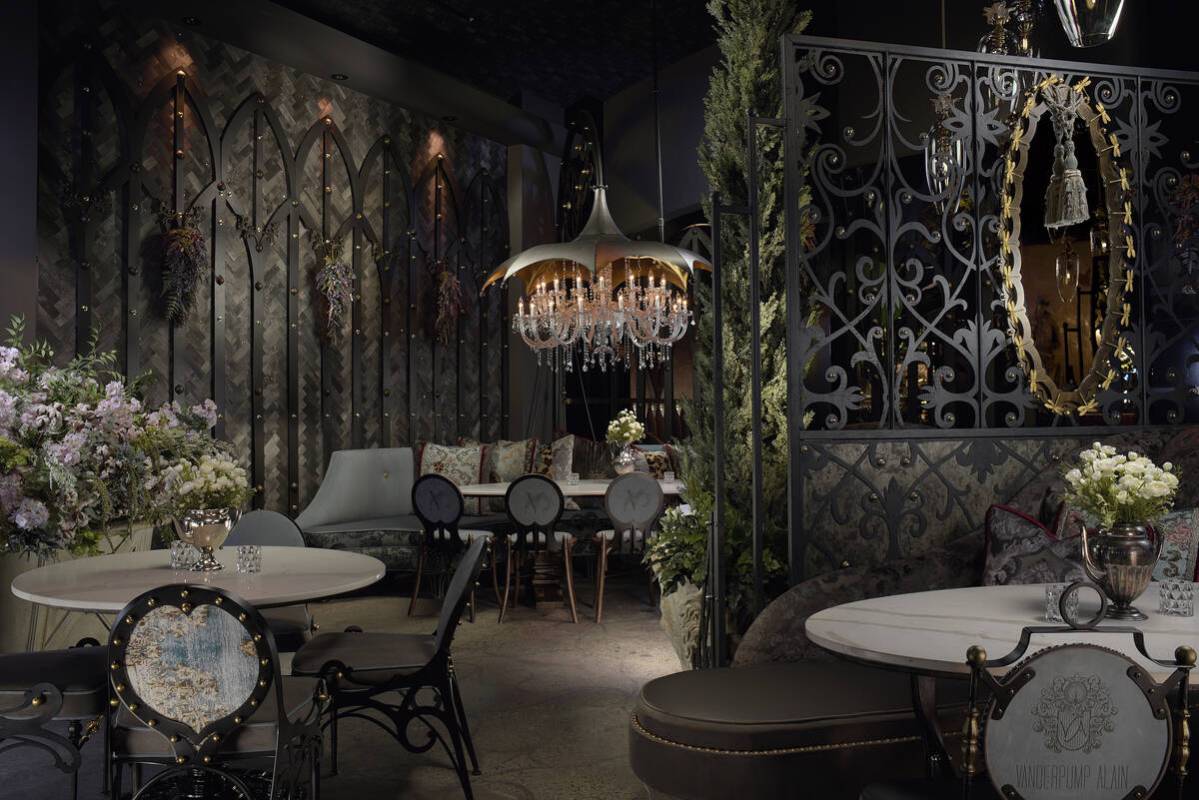 Crystal chandeliers and wrought iron cages are a key focal point of the decor. (Photo credit: E ...