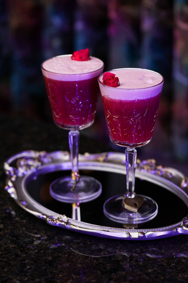 The restaurant's signature LoveLockedcocktail for two. One glass has a padlock and the other ha ...