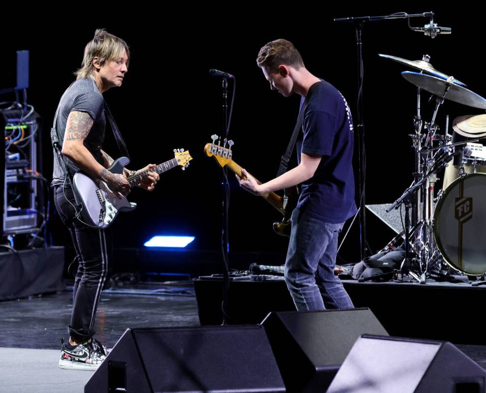 Caesars resident artist Keith Urban jams with Las Vegas Academy student Bradley Love at the Col ...