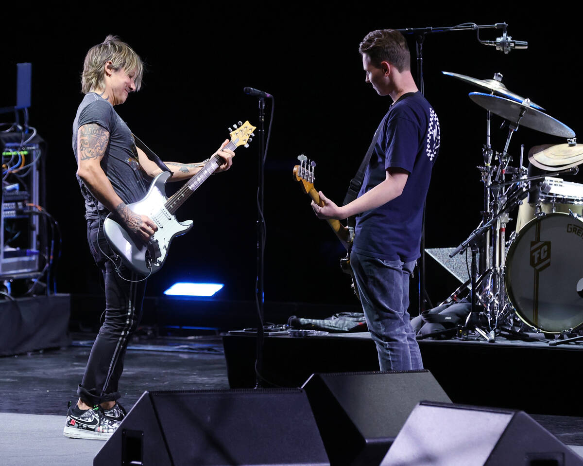 Caesars resident artist Keith Urban jams with Las Vegas Academy student Bradley Love at the Col ...