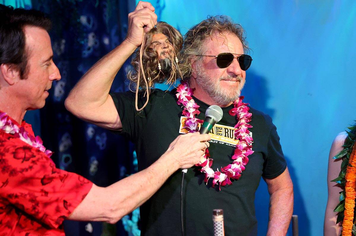 Sammy Hagar shows his shrunken head during an unveiling ceremony at The Golden Tiki in Las Vega ...