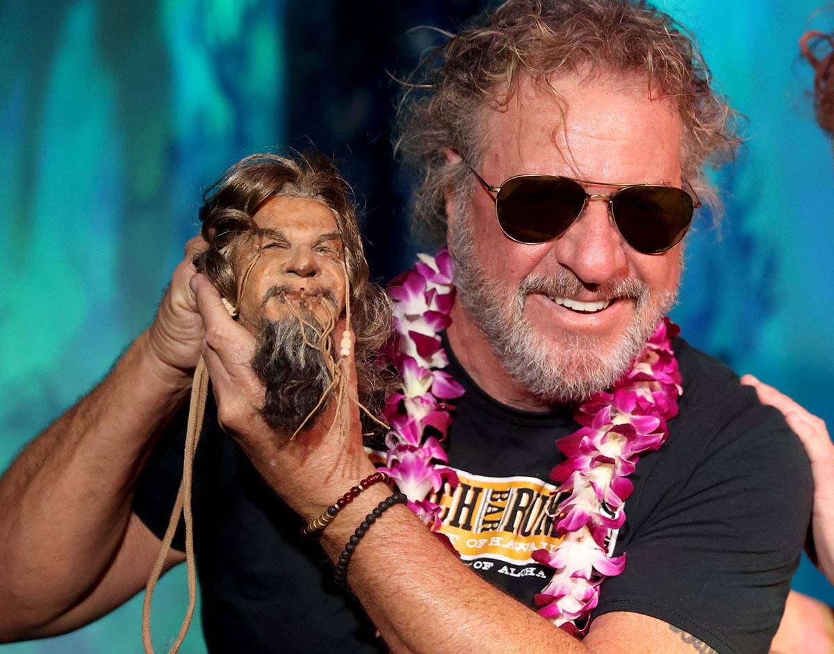 Sammy Hagar shows his shrunken head during an unveiling ceremony at The Golden Tiki in Las Vega ...